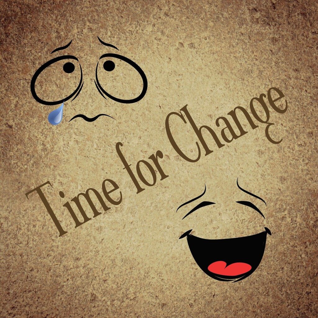 Picture showing crying face and laughing face with time for change written in the middle